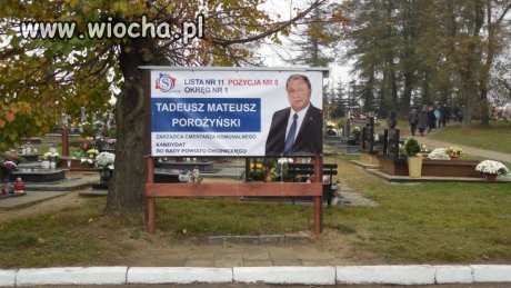 Plakat na cmentarzu...