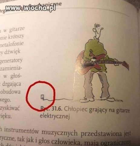 Chłopiec grający na gitarze elektrycznej