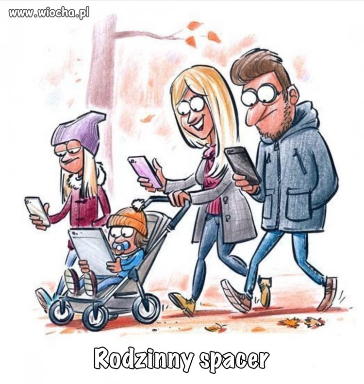 Rodzinny spacer oświetloną aleją